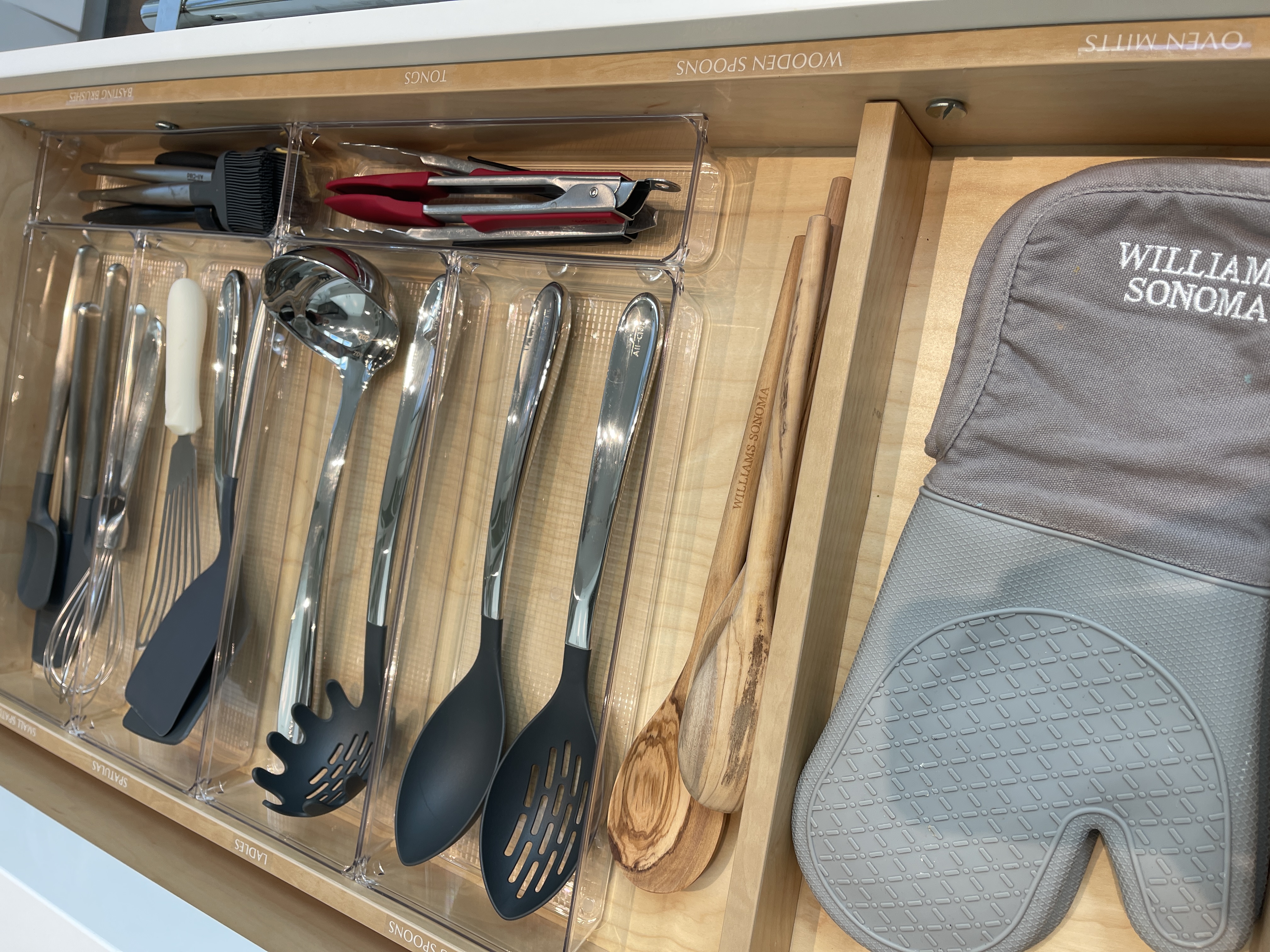 Organized kitchen drawer with custom dividers by Organized Spaces in Los Gatos