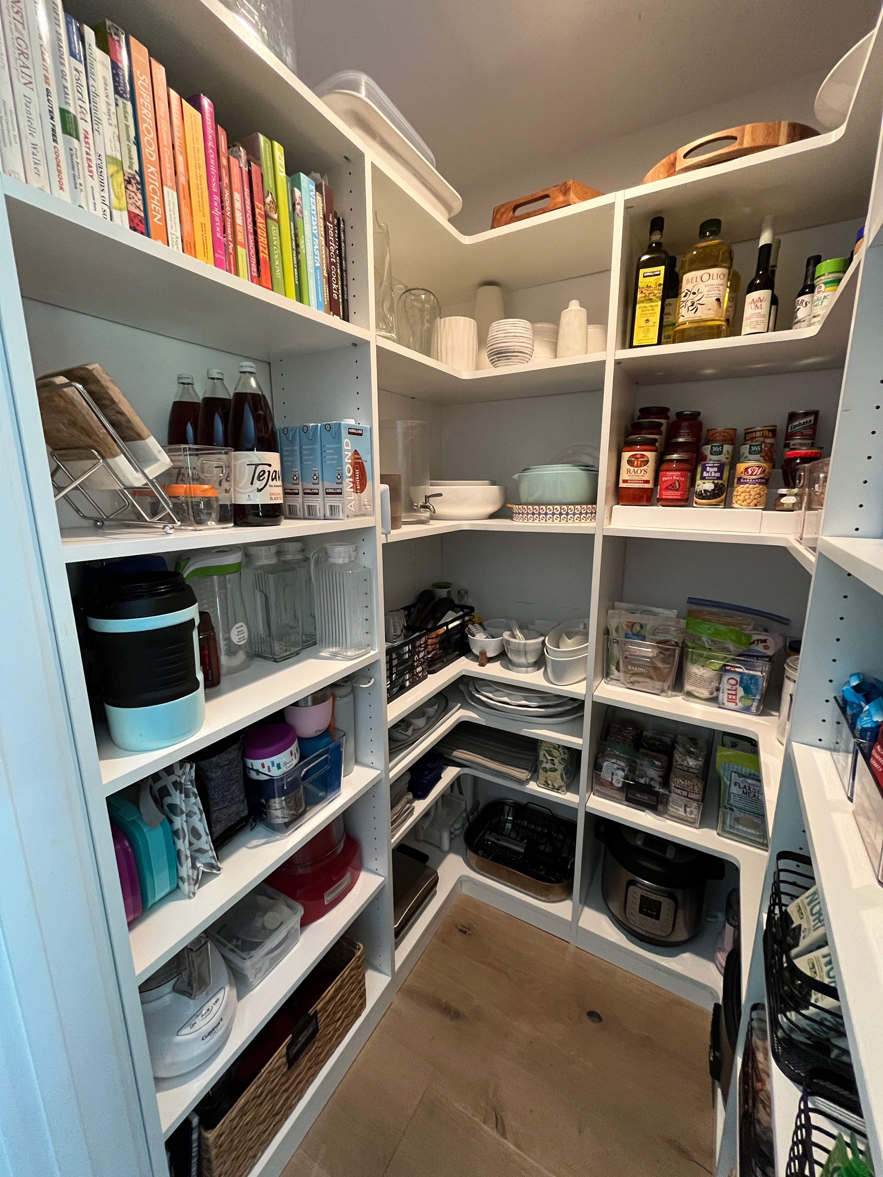 Beautifully organized pantry with labeled containers by Organized Spaces in Los Altos
